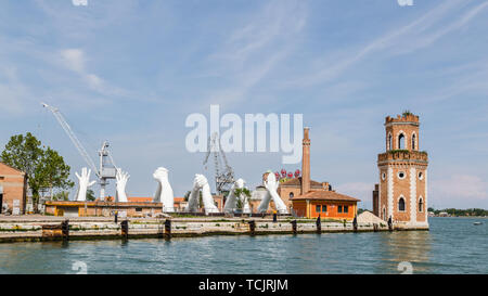 Venice Italy - May 25, 2019: Biennale Arte 2019 Sculpture Building bridges by Lorenzo Quin representing friendship, wisdom, help, faith, hope and love Stock Photo