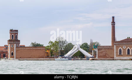 Venice Italy - May 25, 2019: Biennale Arte 2019 Sculpture Building bridges by Lorenzo Quin representing friendship, wisdom, help, faith, hope and love Stock Photo