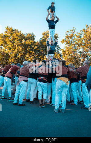 Cambrils, Spain. June 2019: Castells Performance, a castell is a human tower built traditionally in festivals within Catalonia. This is also on the UN Stock Photo