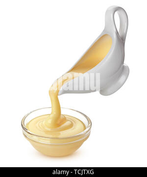 Pouring condensed milk isolated on white background Stock Photo
