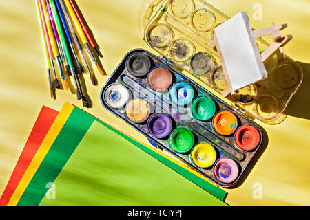 Watercolor Set with Brushes, Easel and Paper. Creativity and painting concept Stock Photo