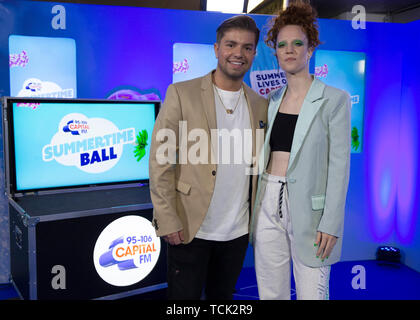 Capital FM presenter Sonny Jay poses with Jess Glynne in the on air studio during Capital's Summertime Ball. The world's biggest stars perform live for 80,000 Capital listeners at Wembley Stadium at the UK's biggest summer party. Stock Photo