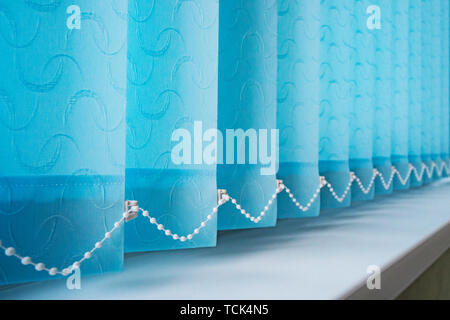 Vertical blinds, Window with vertical blinds and light, Image for Decor. Modern interior design. Closed window from sunlight Stock Photo
