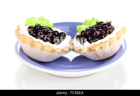 sweet cakes with berries on saucer isolated on white Stock Photo