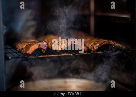 High-quality grilling with smoke aromas and smoking boards, Germany Stock Photo