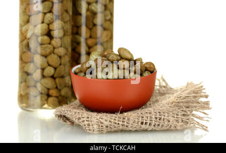 green capers in ceramical bowl on white background Stock Photo