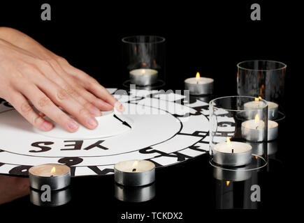 spiritualistic seance by candlelight close-up Stock Photo