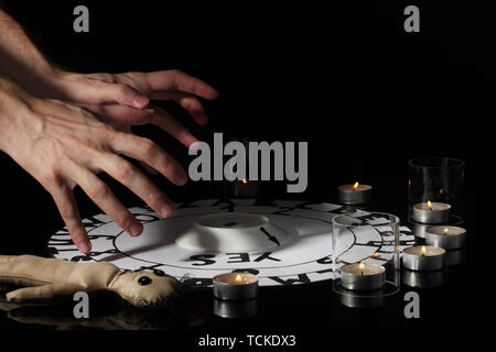 spiritualistic seance by candlelight close-up Stock Photo