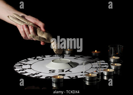 spiritualistic seance by candlelight close-up Stock Photo