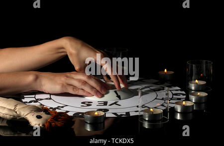 spiritualistic seance by candlelight close-up Stock Photo