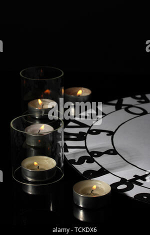 spiritualistic seance by candlelight close-up Stock Photo