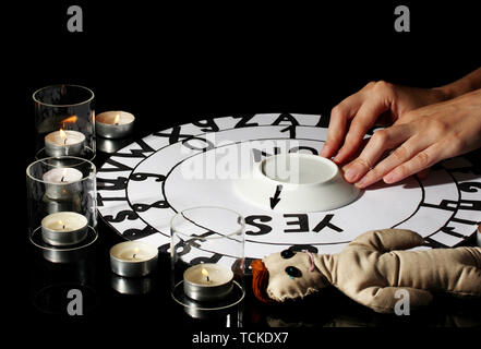 spiritualistic seance by candlelight close-up Stock Photo