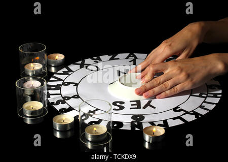 spiritualistic seance by candlelight close-up Stock Photo