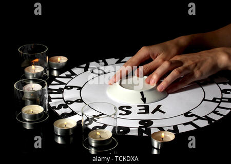 spiritualistic seance by candlelight close-up Stock Photo