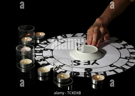 spiritualistic seance by candlelight close-up Stock Photo