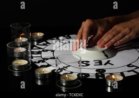 spiritualistic seance by candlelight close-up Stock Photo