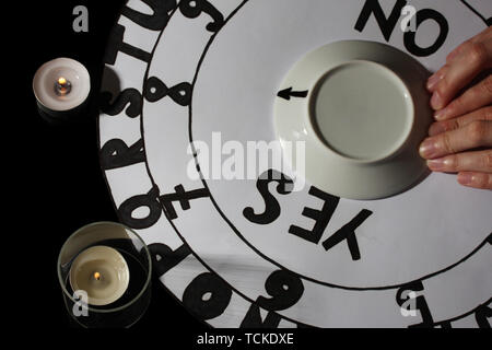 spiritualistic seance by candlelight close-up Stock Photo