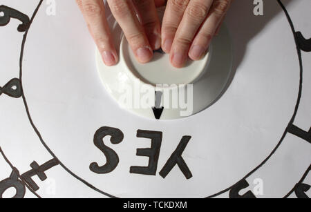 spiritualistic seance by candlelight close-up Stock Photo