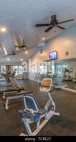 Panorama Interior Of A Spacious Fitness Gym With Various Exercise
