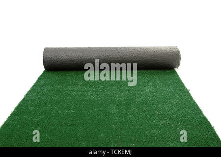 Artificial rolled green grass isolated on white Stock Photo