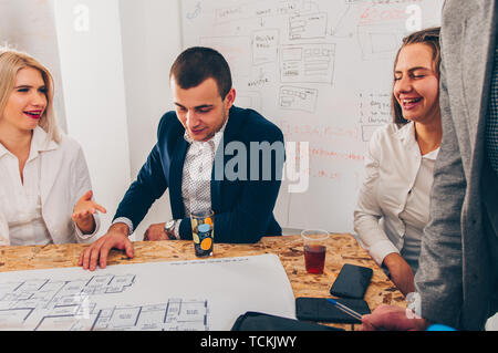 A group od modern architects are working on sketch in the office Stock Photo