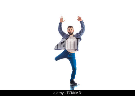 Man in studio is doing freeestyle breakdance Stock Photo