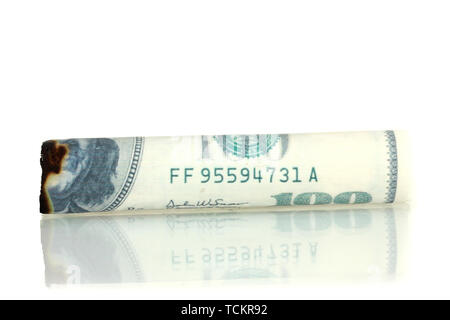 Cigar of the 100 dollar bill isolated on white Stock Photo