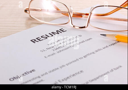 Closeup of resume with glasses - Closeup Of Resume With Pencil And Glasses On Table Tcm1rj 