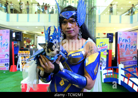 Antipolo, Philippines. 08th June, 2019. Greg Porran, posses with his dog name Princes Sophie a 2 year old Chihuahua bread with “Amihan” costume during the “Fluffy Heroes” activities as part of advance celebration of Philippine Independence Day at SM Masinag in Antipolo City on June 8, 2019. Credit: Gregorio B. Dantes Jr./Pacific Press/Alamy Live News Credit: PACIFIC PRESS/Alamy Live News Stock Photo