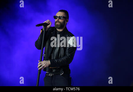 Adam Levine of Maroon 5 on stage during Capital's Summertime Ball. The world's biggest stars perform live for 80,000 Capital listeners at Wembley Stadium at the UK's biggest summer party. Stock Photo