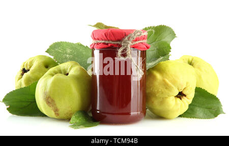 jar of jam  and quinces with leaves, isolated on white Stock Photo