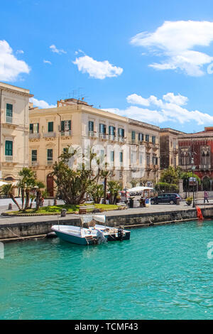 Syracuse, Sicily, Italy - Apr 10th 2019: Amazing harbour between the historical city Syracuse and famous Ortigia Island. Part of UNESCO World Heritage. Popular tourist spot. Stock Photo