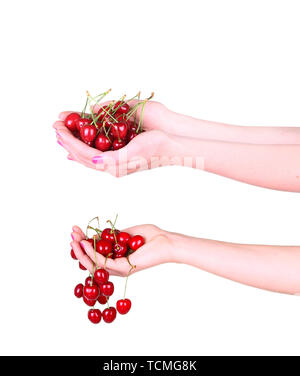 collage Cherries in a female hand on a white Stock Photo