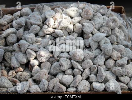 Small cardboard box with dehydrated and sugary figs Stock Photo