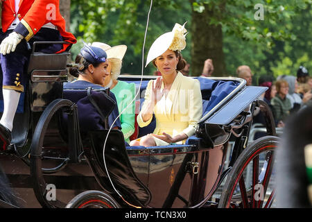 London, UK. 08th June, 2019. Catherine Duchess of Cambridge (R) and Meghan Duchess of Sussex (L) are seen in a carriage on their way to the Horse Guards Parade during the Trooping the Colour ceremony, which marks the 93rd birthday of Queen Elizabeth II, Britain's longest reigning monarch. Credit: SOPA Images Limited/Alamy Live News Stock Photo
