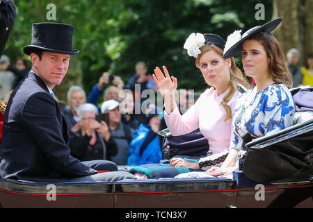 London, UK. 08th June, 2019. Princess Beatrice of York (L) and Princess Eugenie (R) are seen in a carriage on their way to the Horse Guards Parade during the Trooping the Colour ceremony, which marks the 93rd birthday of Queen Elizabeth II, Britain's longest reigning monarch. Credit: SOPA Images Limited/Alamy Live News Stock Photo