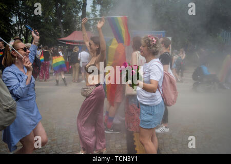 Warsaw, Poland. 08th June, 2019. People covered in smoke during the Warsaw Pride. The Equality March also called the Warsaw Pride parade, brought thousands of people to the streets of Warsaw, at the time when the gay rights movement in Poland is under siege by hate speech and a government campaign depicting it as a threat to families and society. Credit: SOPA Images Limited/Alamy Live News Stock Photo