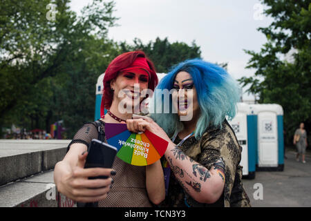 Warsaw, Poland. 08th June, 2019. Two drag queens take selfies during the Warsaw Pride. The Equality March also called the Warsaw Pride parade, brought thousands of people to the streets of Warsaw, at the time when the gay rights movement in Poland is under siege by hate speech and a government campaign depicting it as a threat to families and society. Credit: SOPA Images Limited/Alamy Live News Stock Photo