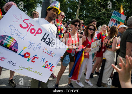 Warsaw, Poland. 08th June, 2019. Man holds a huge placard during the equality march. The Equality March also called the Warsaw Pride parade, brought thousands of people to the streets of Warsaw, at the time when the gay rights movement in Poland is under siege by hate speech and a government campaign depicting it as a threat to families and society. Credit: SOPA Images Limited/Alamy Live News Stock Photo