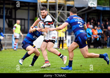 Sale, Greater Manchester, UK. 9th June 2019, Heywood Road stadium, Sale, Greater Manchester, England; Betfred Rugby Championship, Swinton versus Toronto Wolfpack; Blake Wallace of Toronto Wolfpack smiles as he attempts to break through the Swinton Lions defence Credit: Action Plus Sports Images/Alamy Live News Stock Photo