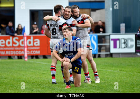 9th June 2019, Heywood Road stadium, Sale, Greater Manchester, England; Betfred Rugby Championship, Swinton versus Toronto Wolfpack; Bob Beswick of Toronto Wolfpack celebrates scoring his try with Andrew Dixon and Liam Kay making the score 6 - 26 in the 62nd minute Stock Photo