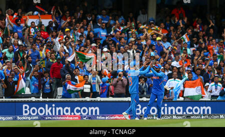 The Kia Oval, London, UK. 9th June, 2019. ICC Cricket World Cup, New Zealand versus Australia; Virat Kohli of India celebrates with Ravindra Jadeja of India and the Indian fans as he takes the catch to dismiss Nathan Coulter-Nile of Australia for 4 runs to make it 283-7 off 44 overs Credit: Action Plus Sports/Alamy Live News Stock Photo