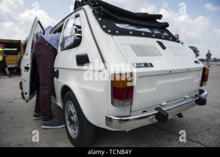 Warsaw, Mazowieckie, Poland. 8th June, 2019. The back view of a cabrio white Fiat 126p during the birthday meeting.Hundreds of cars arrived to Warsaw for a special rally to celebrate Fiat 126's 46th birthday. Fiat 126 better known as the Polski (Polish) Fiat 126p was produced in Poland from June 6, 1973 to September 22, 2000. For many years it was one of the most common cars on the roads in Poland and has many colloquial names, the most popular of which - Maluch (the Toddler) - became the official name of the model at the end of the production. Fiat 126p became a legend and an icon of the com Stock Photo