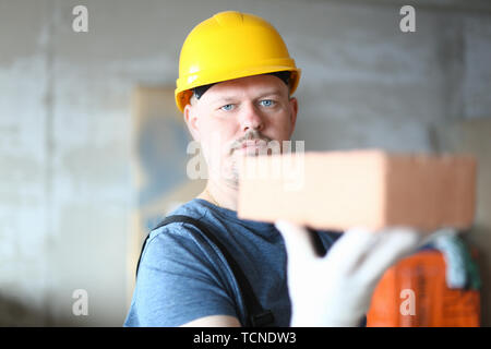Serious worker in hardhat Stock Photo