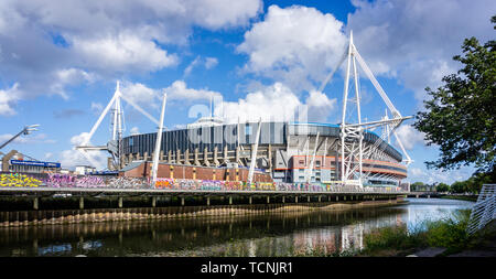 The Principality or Millennium Stadium from the west bank of the river Taff,  in Cardiff, Wales, UK on 8 June 2019