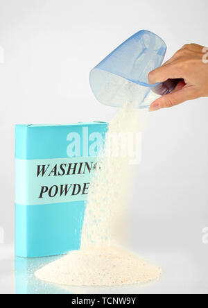 Laundry Detergent Or Washing Powder In A Blue Measuring Cup On A