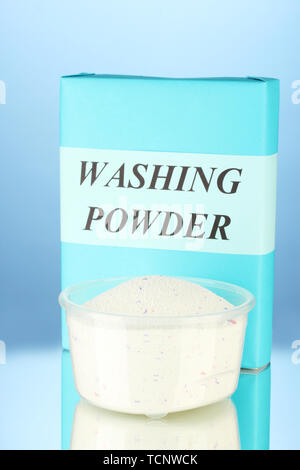 Premium Photo  Laundry detergent in a measuring cup on a blue background