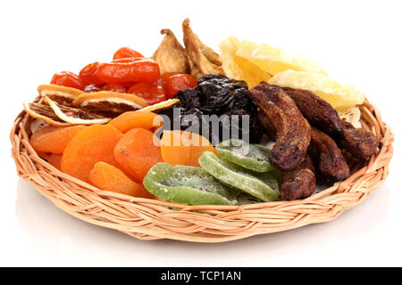 Dried fruits on wicker plate isolated on white Stock Photo