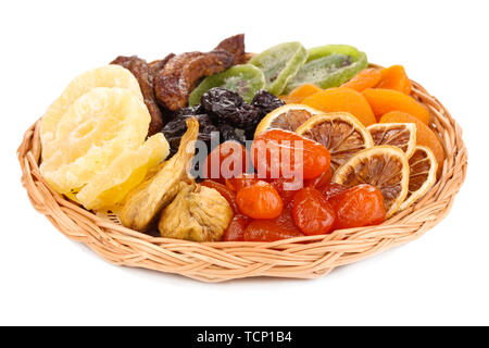 Dried fruits on wicker plate isolated on white Stock Photo