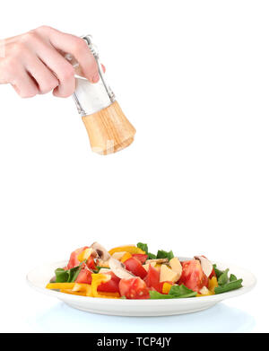Hand Using Salt Shaker Hand adding salt using salt shaker isolated on white Stock Photo - Alamy
